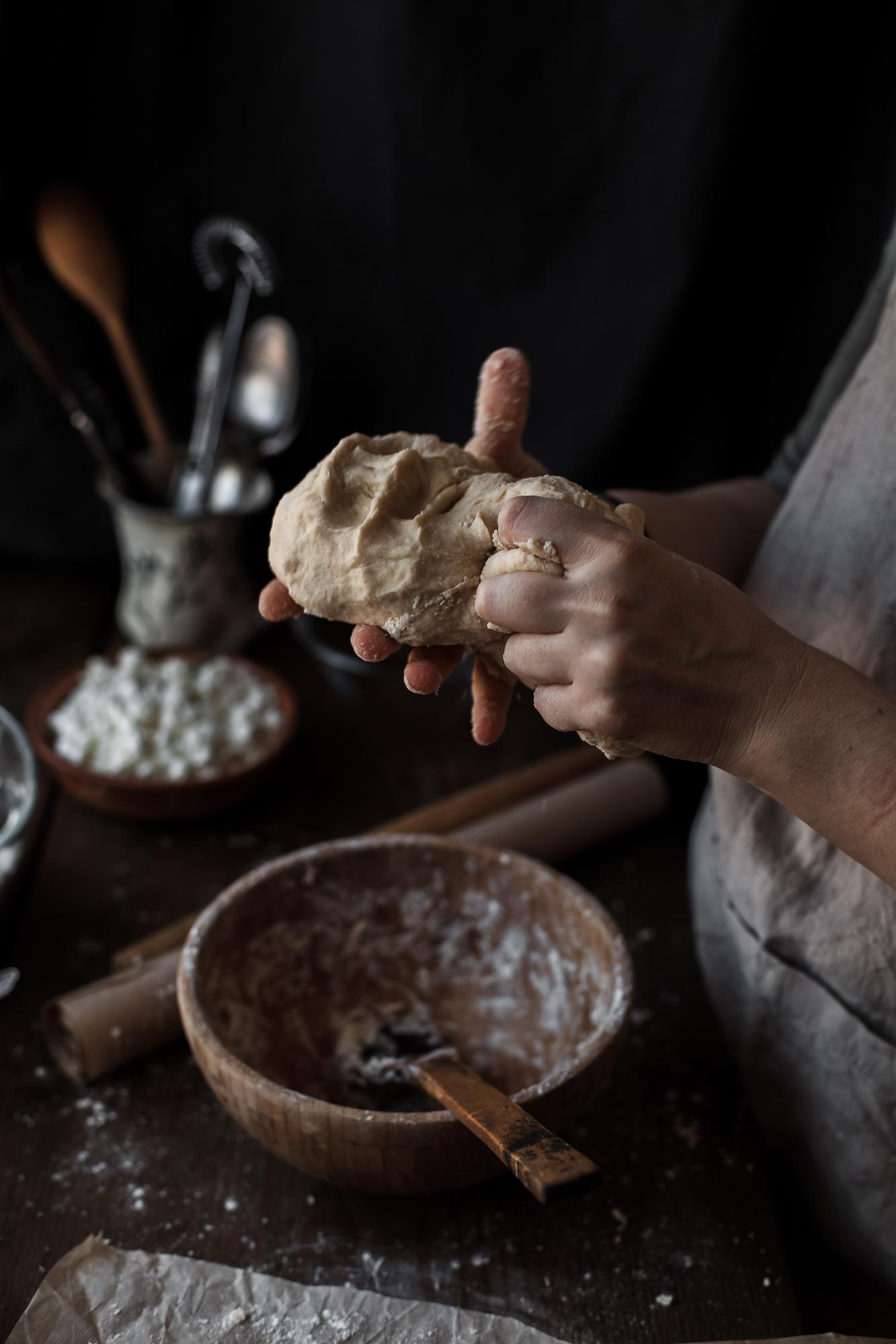 Hands kneading dough closeup